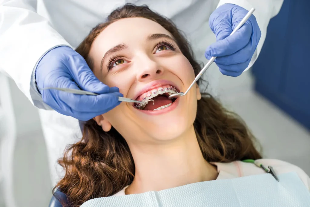 Girl-with-Braces-in-Pembroke-Pines-Getting-a-Dental-Cleaning
