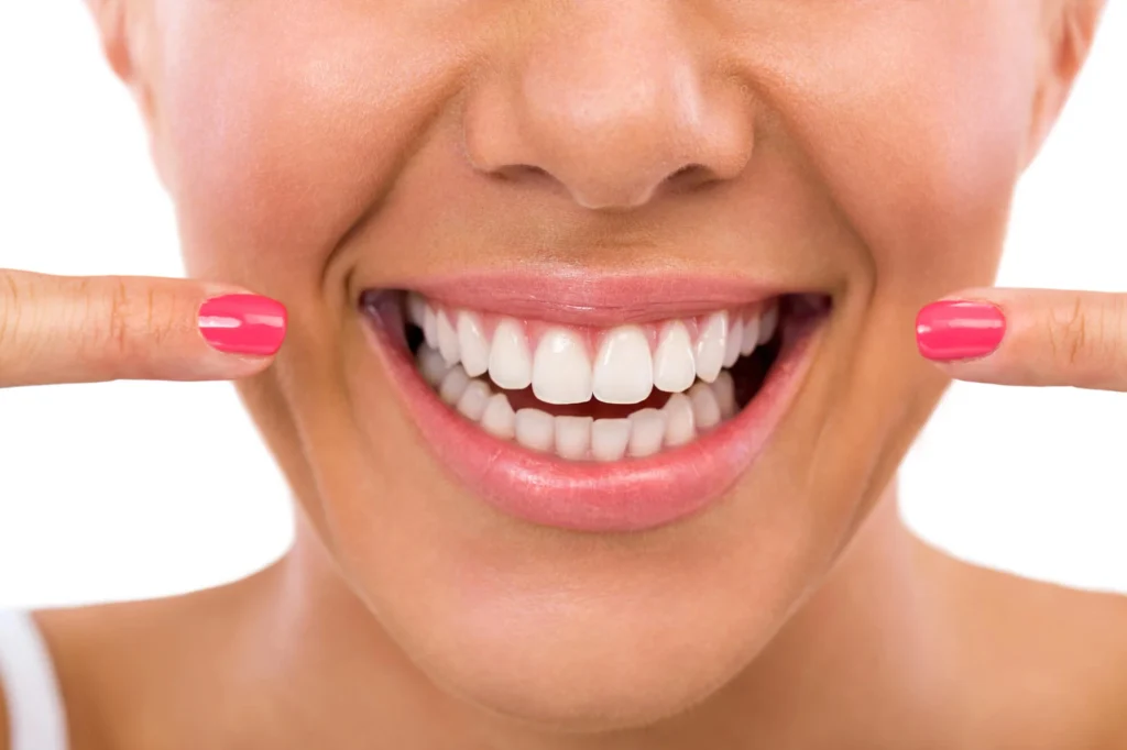 Patient undergoing professional teeth whitening procedure with UV light in a dental clinic for a brighter smile. Teeth whitening in Pembroke Pines