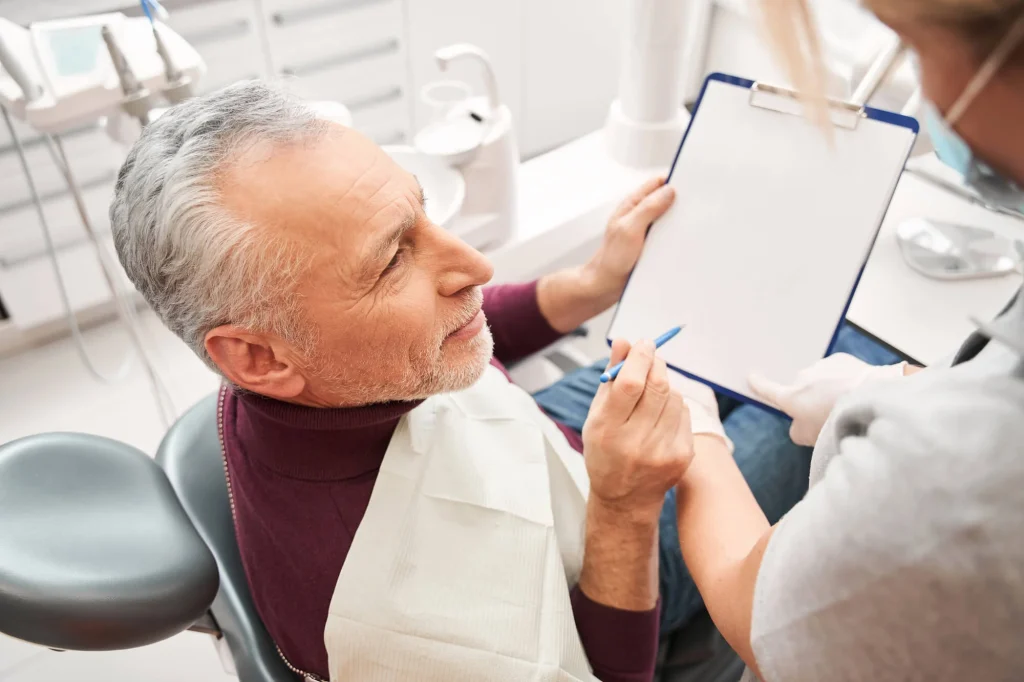 Dentists who take Medicare in Pembroke Pines discussing treatment.