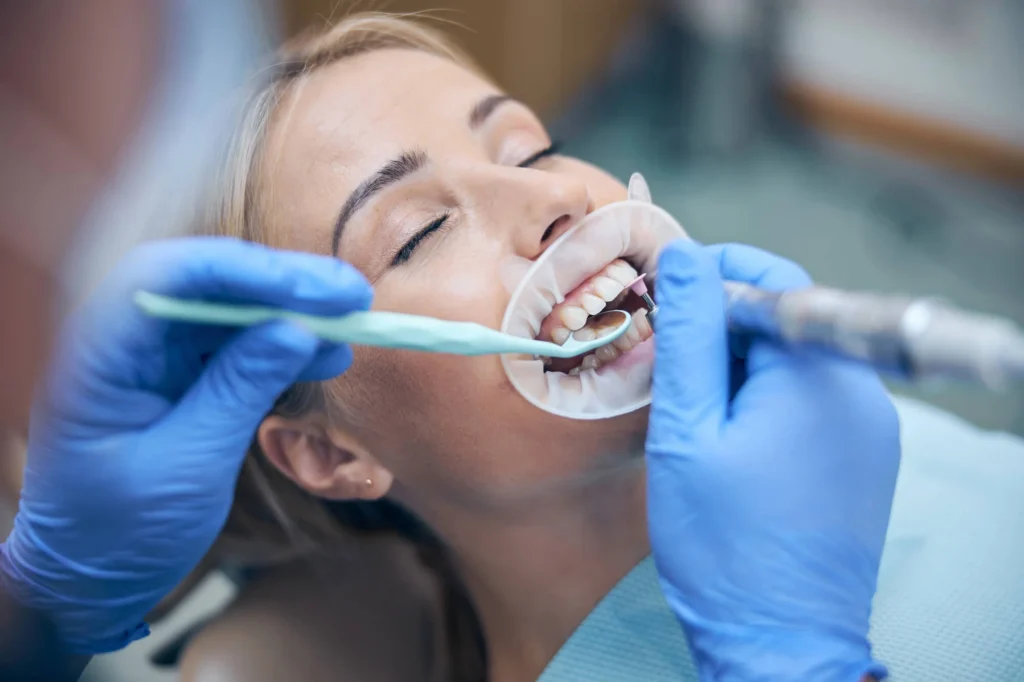 Female patient using nitrous oxide for sedation dentistry in Pembroke Pines.