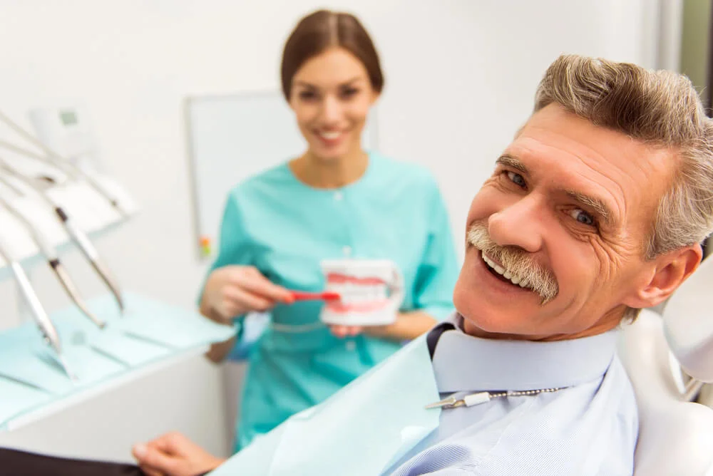 Dentist in 33026 and senior patient.