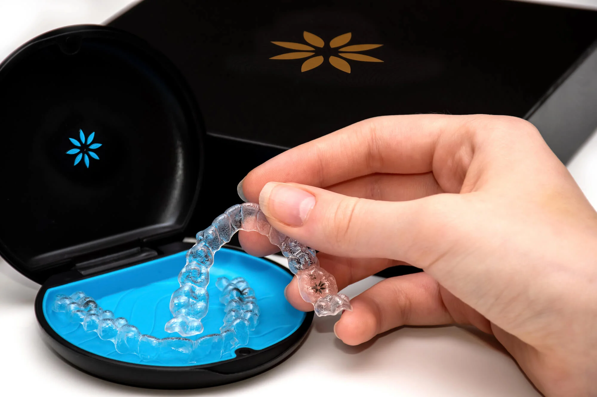 Patient holding Invisalign in Pembroke Pines.