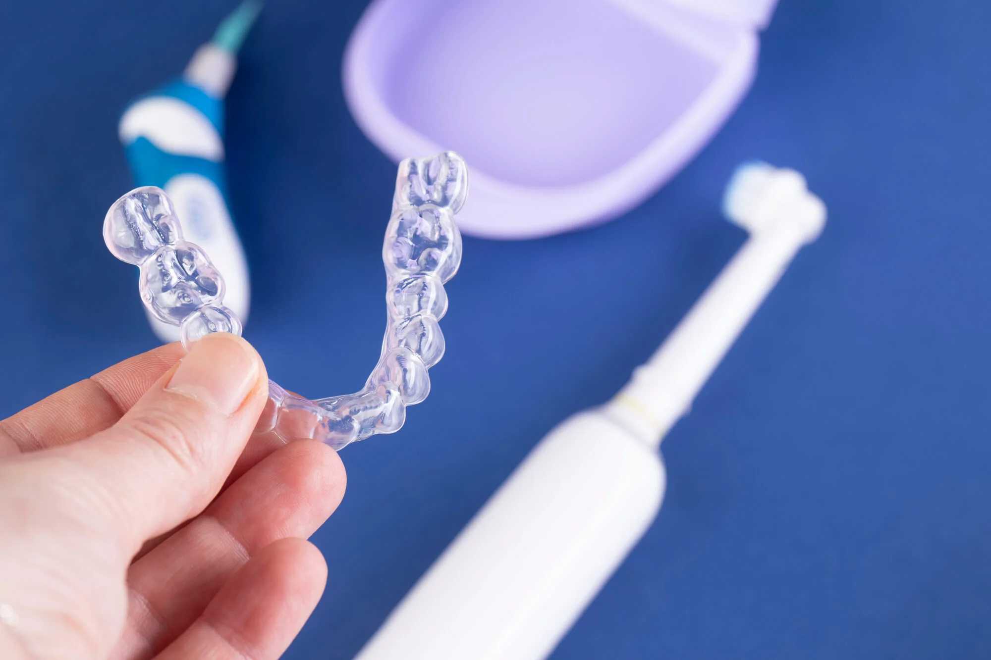 Person holding Invisalign in Pembroke Pines.