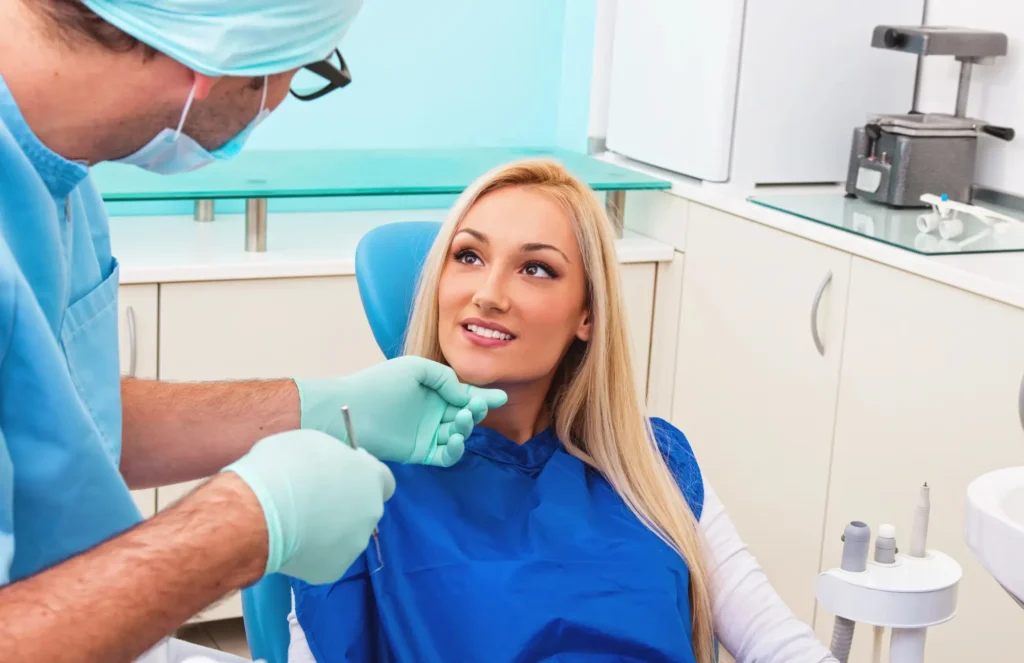 Dentist working with patient in clinic, oral surgeon 33026